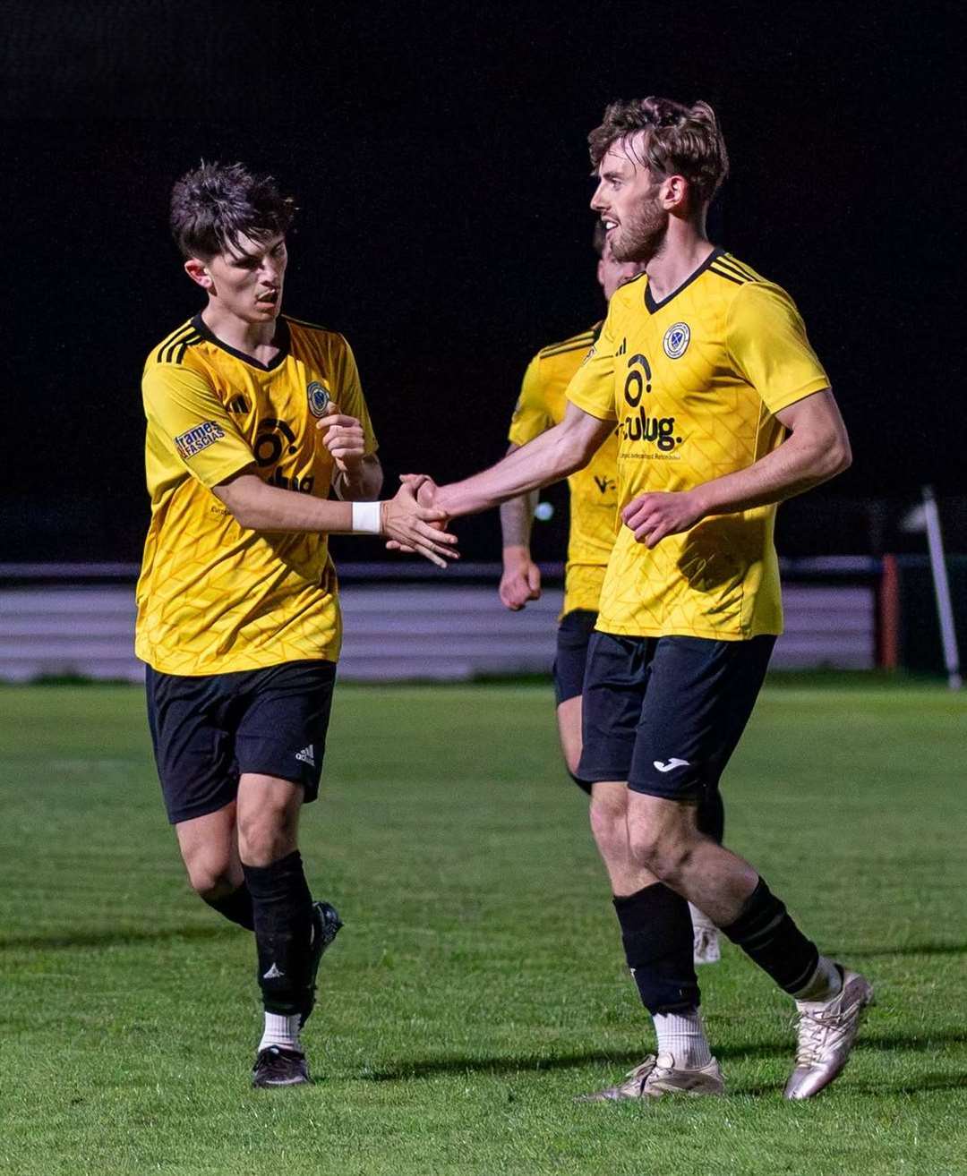 Jacob Boyes, left, is congratulated after equalising. Photo: Steve Nesbitt @lincssnapper