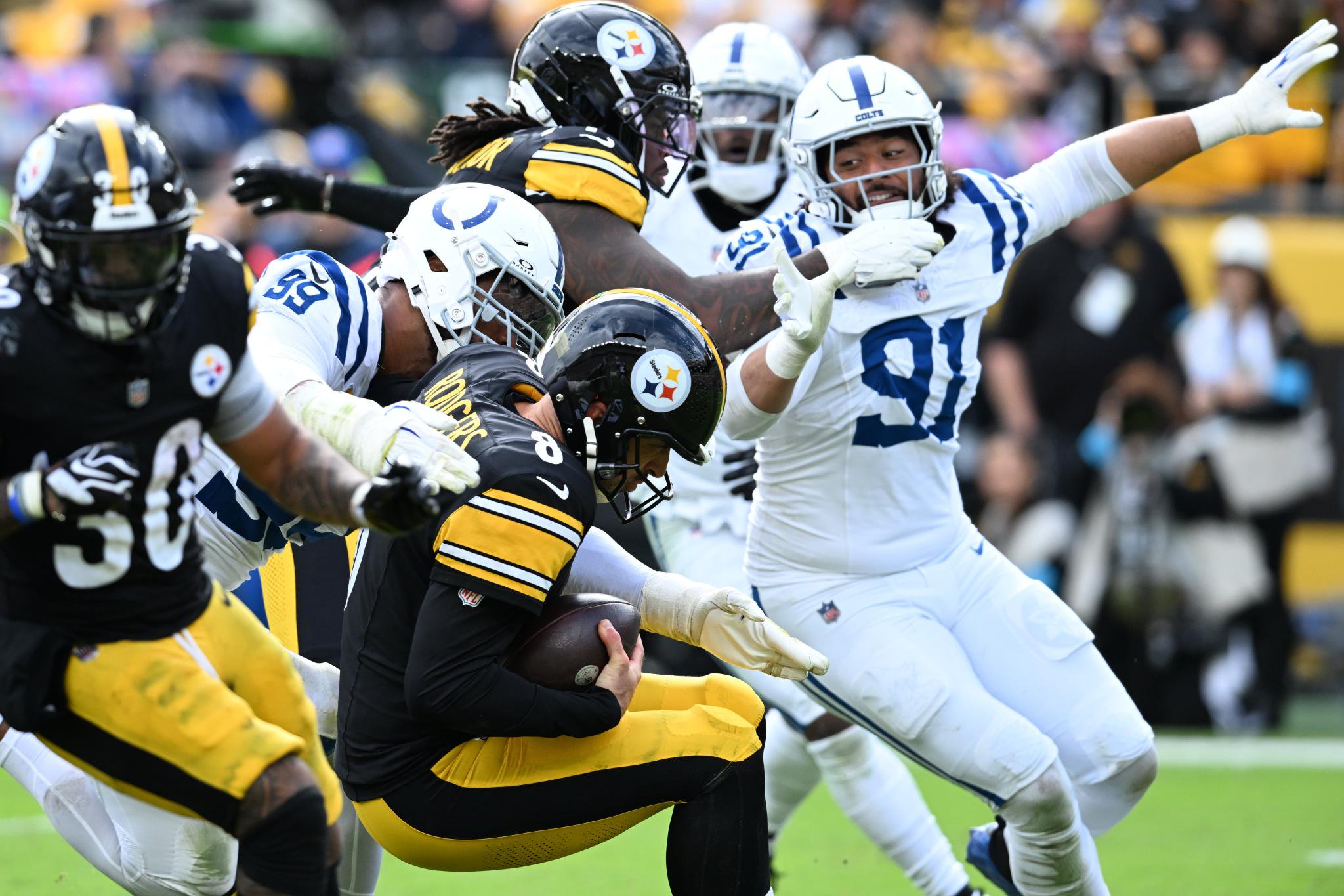 Indianapolis Colts defensive tackle DeForest Buckner sacks Pittsburgh Steelers quarterback Aaron Rodgers.