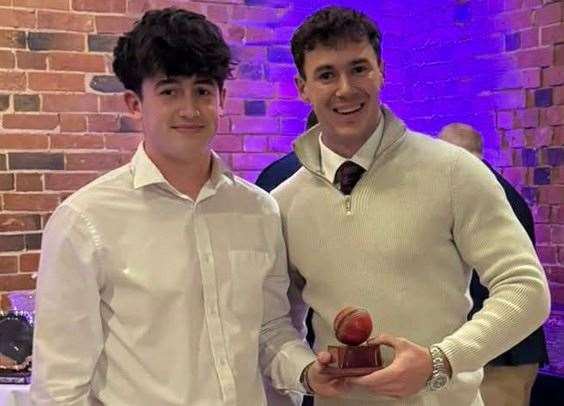 Ollie Watson receives the 1st XI Captain's Ball from Andrew Dellow.