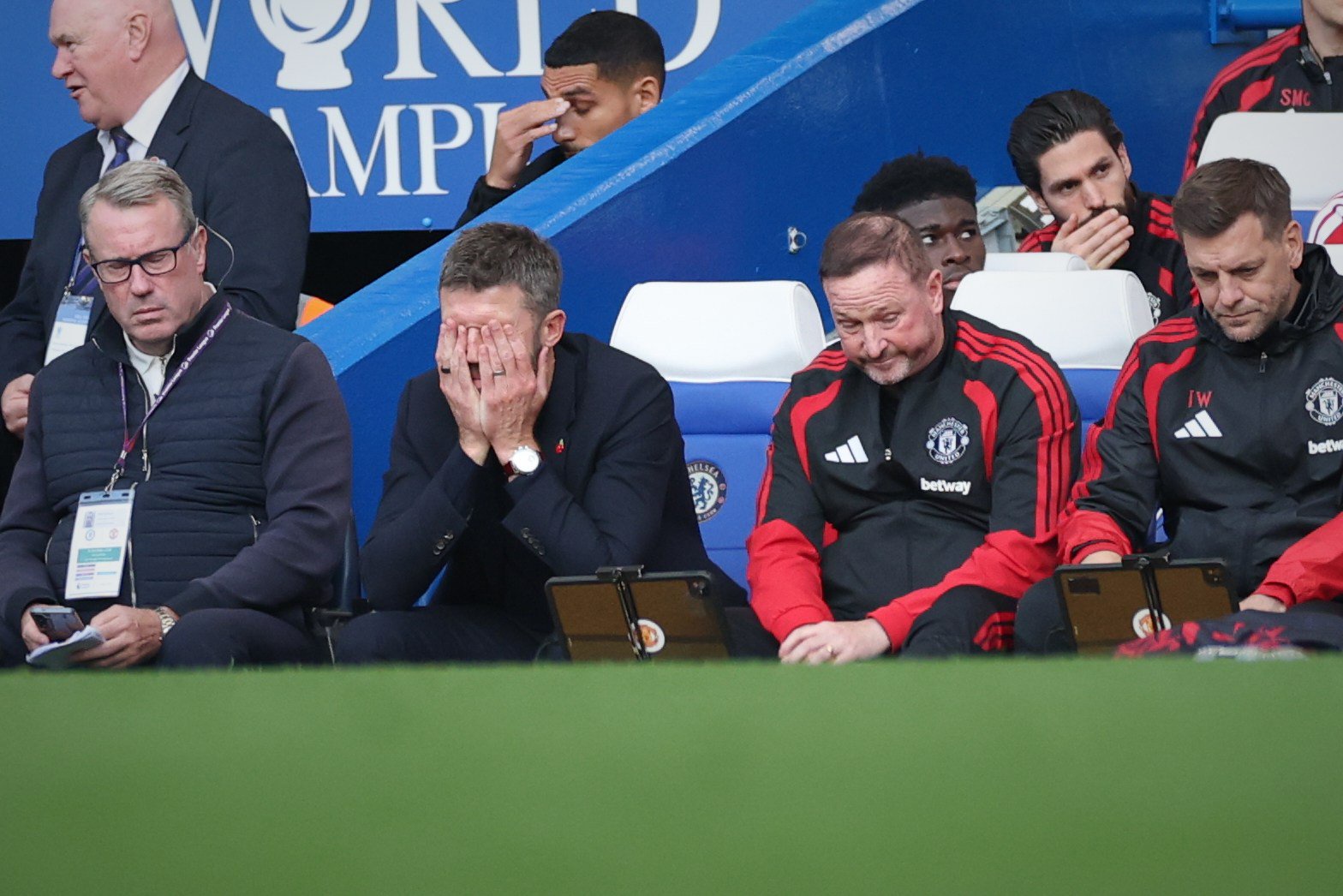 Manchester United's head coach Michael Carrick, centre left, reacts during the English Premier League soccer match between Chelsea and Manchester United in London, Saturday, Oct. 31, 2026. (AP Photo/Ian Walton)