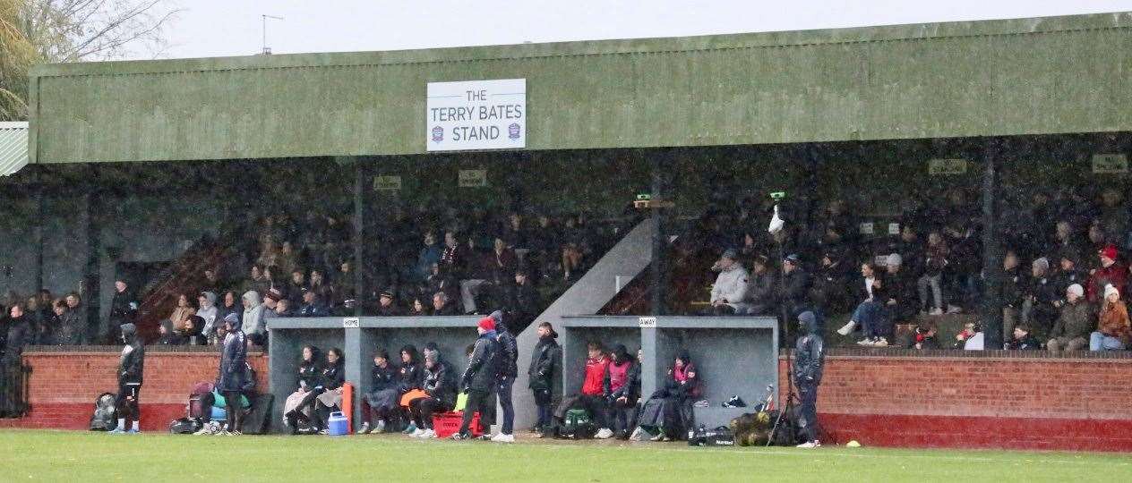 The fans packed into the Terry Bates Stand on a wet day at the Abbey Lawn. Photo: Jason Richardson