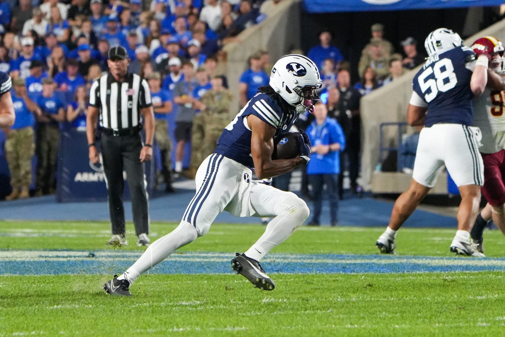 Oct 9, 2026; Provo, Utah, USA;  BYU Cougars wide reciever Jojo Phillips (13) runs the ball during the second half against the Iowa State Cyclones at LaVell Edwards Stadium.  Mandatory Credit: Aaron Baker-Imagn Images