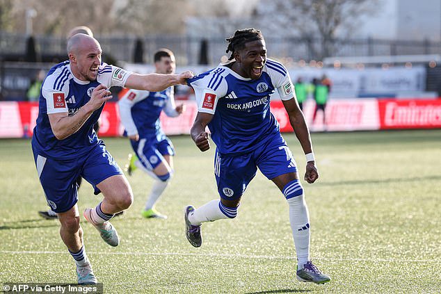 Macclesfield's Isaac Buckley-Ricketts (right) celebrates scoring their second goal in the famous 2-1 victory