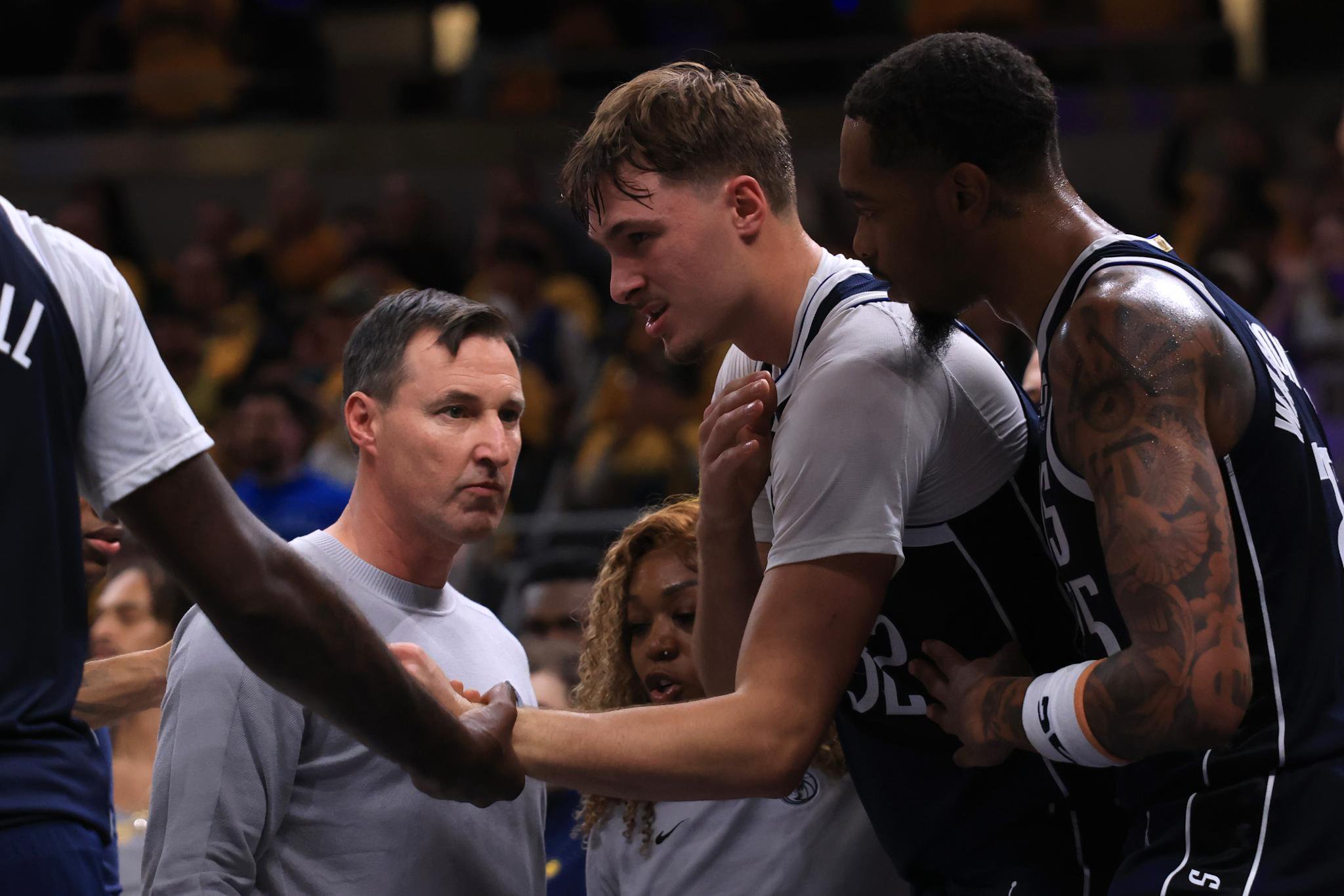 Cooper Flagg holds his shoulder after being fouled during the second quarter against the Indiana Pacers at Gainbridge Fieldhouse on October 23, 2026. 