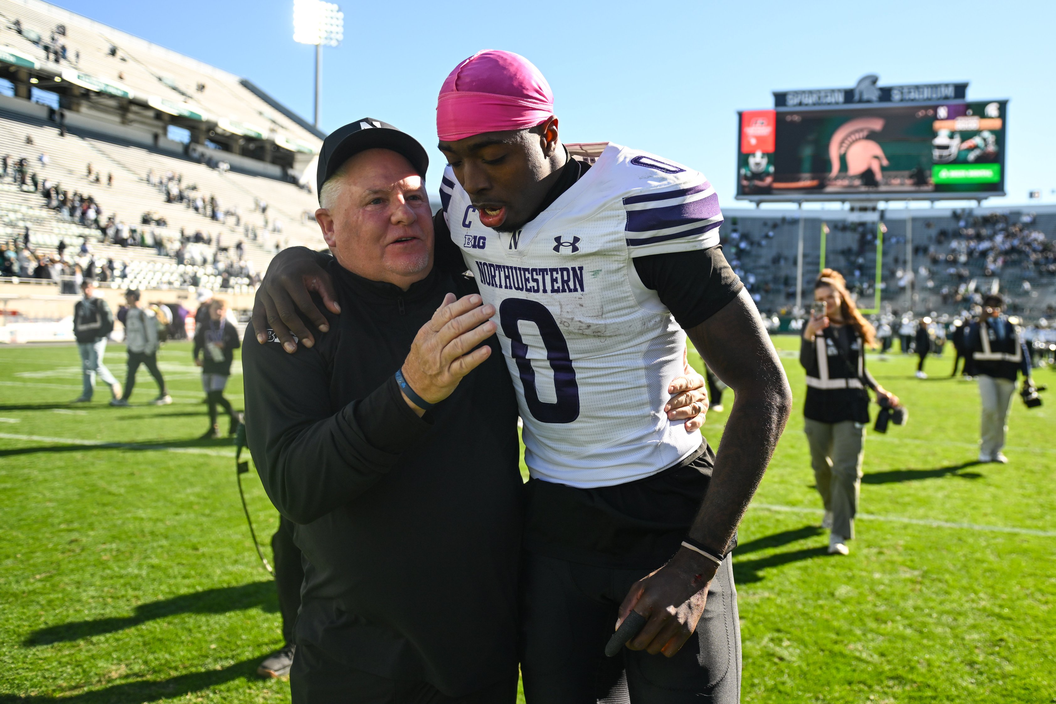 EAST LANSING, MI - OCTOBER 17: Northwestern Wildcats quarterback Aidan Chiles (0) walks off the field with offensive coordinator Chip Kelly following a college football game between the Michigan State Spartans and Northwestern Wildcats on October 17, 2026 at Spartan Stadium in East Lansing, MI. (Photo by Adam Ruff/Icon Sportswire via Getty Images)