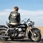 Dear Abby: Should I tell my husband who the man in the motorcycle club is?