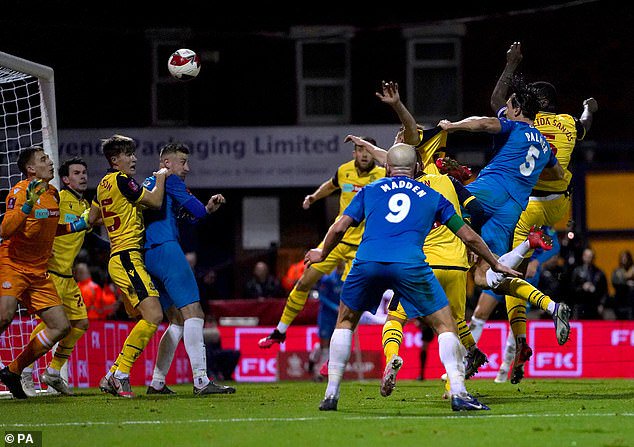 Ashley Palmer (5) powers in a header to bring Stockport back from the dead and send the tie to extra time