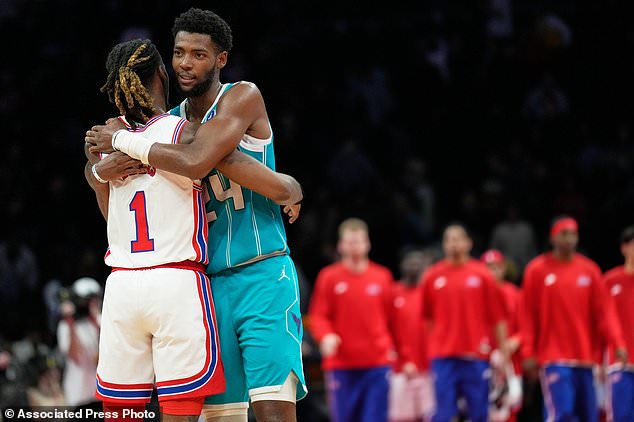 Charlotte Hornets' Brandon Miller, right, greets Brooklyn Nets' Keon Ellis after an NBA basketball game Wednesday, Oct. 21, 2026, in New York. (AP Photo/Seth Wenig)