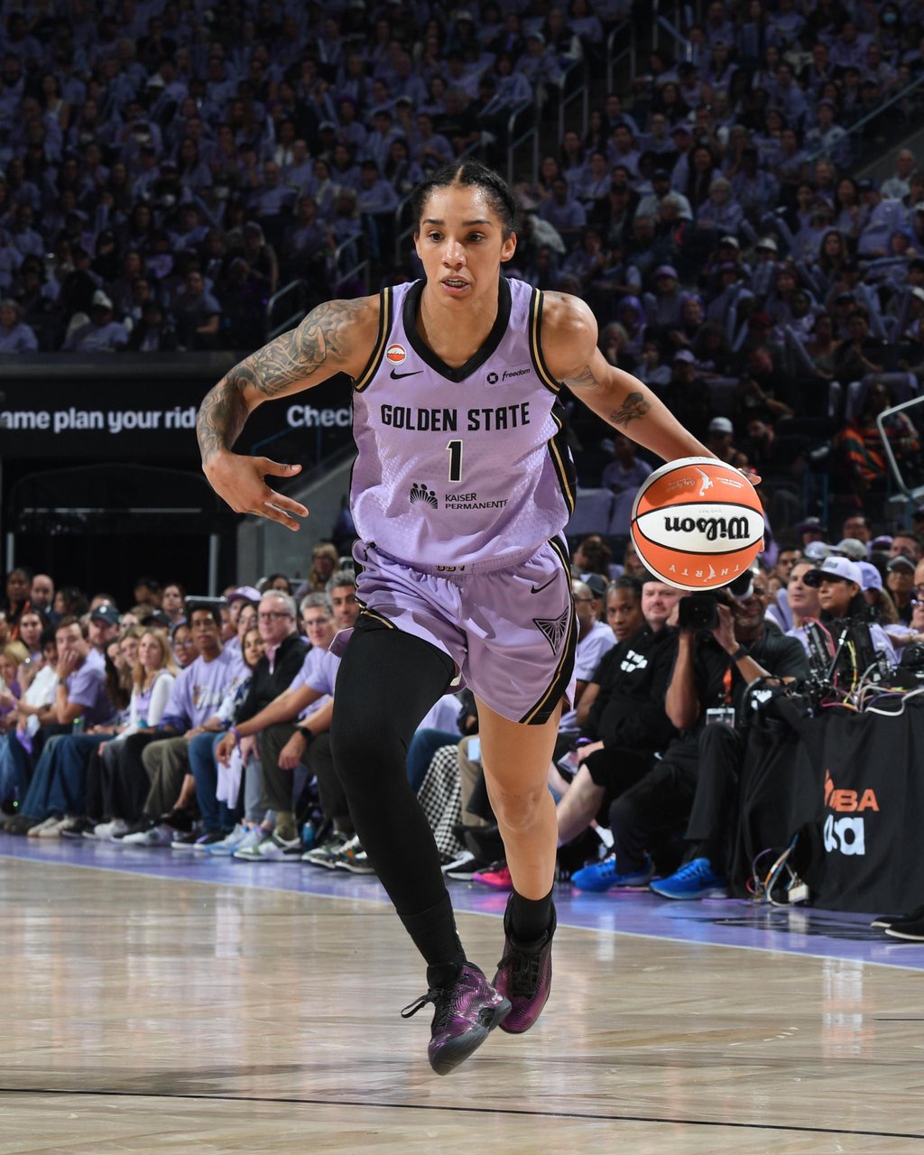 Golden State Valkyries' Veronica Burton dribbles the ball during a WNBA game.