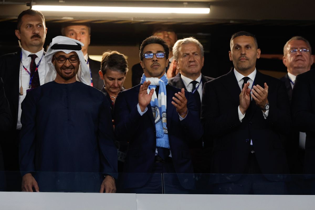 The Manchester City owner Abu Dhabi royal Sheikh Mansour bin Zayed Al Nahyan (centre with scarf) next to chairman Khaldoon Al Mubarrak (right) before the 2023 Champions League final