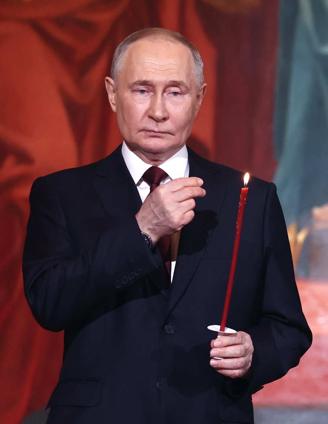 Vladimir Putin pictured today at church as Russians marked Orthodox Easter