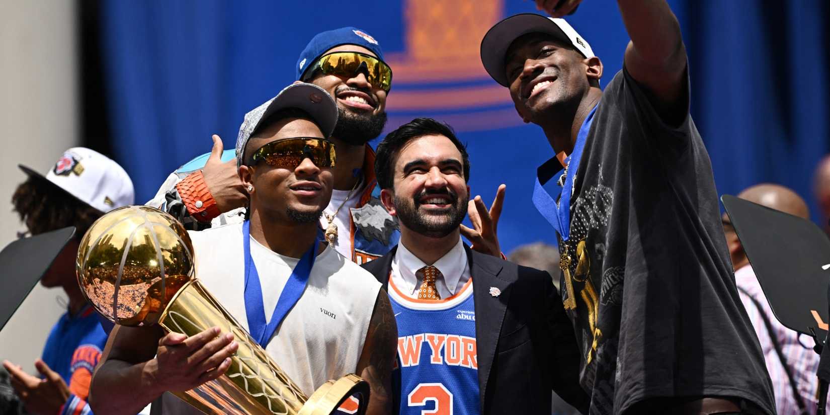 Knicks players celebrate winning the 2026 NBA Championship with New York City mayor Zohran Mamdani