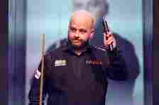 Luca Brecel of Belgium walks out to take on David Gilbert of England before their first round match during day one of the Cazoo World Snooker Championship