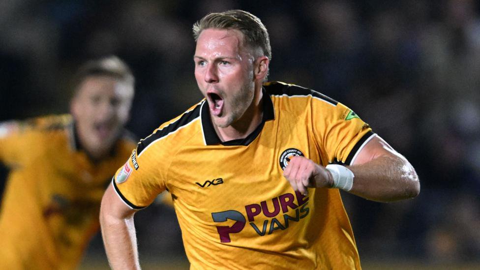 Cameron Norman celebrates scoring for Newport County against Chesterfield