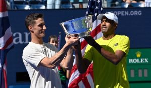 Pictured: Joe Salisbury and Rajeev Ram lift the 2021 US Open doubles trophy