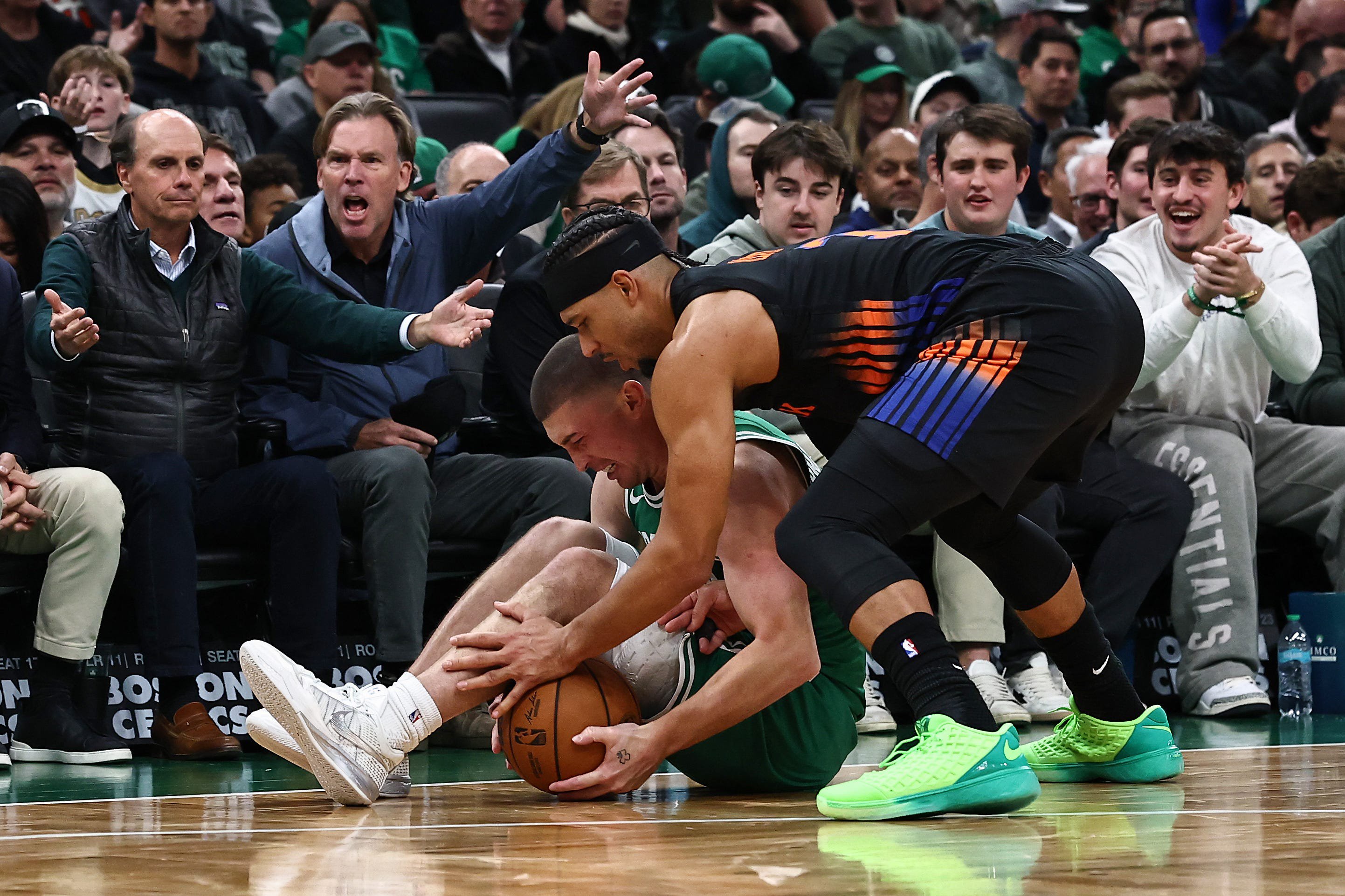 Oct 23, 2026; Boston, Massachusetts, USA; Boston Celtics guard Payton Pritchard (11) and New York Knicks guard Josh Hart (3) battle for a loose ball during the second half at TD Garden. Mandatory Credit: Winslow Townson-Imagn Images