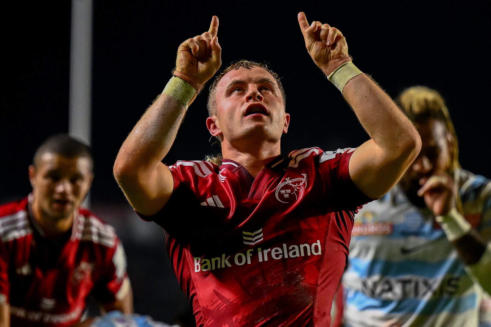 Craig Casey celebrates after scoring Munster's fifth try with acknowledgement to Anthony ‘Axel’ Foley by looking up to the sky during the Champions Cup win over Racing 92 at Páirc Ui Chaoimh in Cork