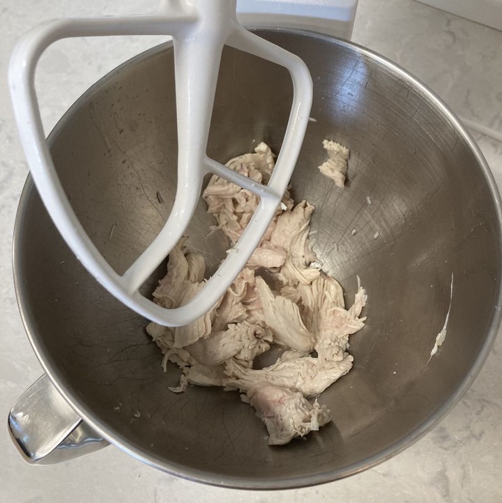shredded chicken in a stand mixer