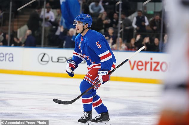 New York Rangers' Sean Durzi (5) skates toward his bench after scoring a goal during the first period of an NHL hockey game against the Anaheim Ducks Monday, Oct. 19, 2026, in New York. (AP Photo/Frank Franklin II)