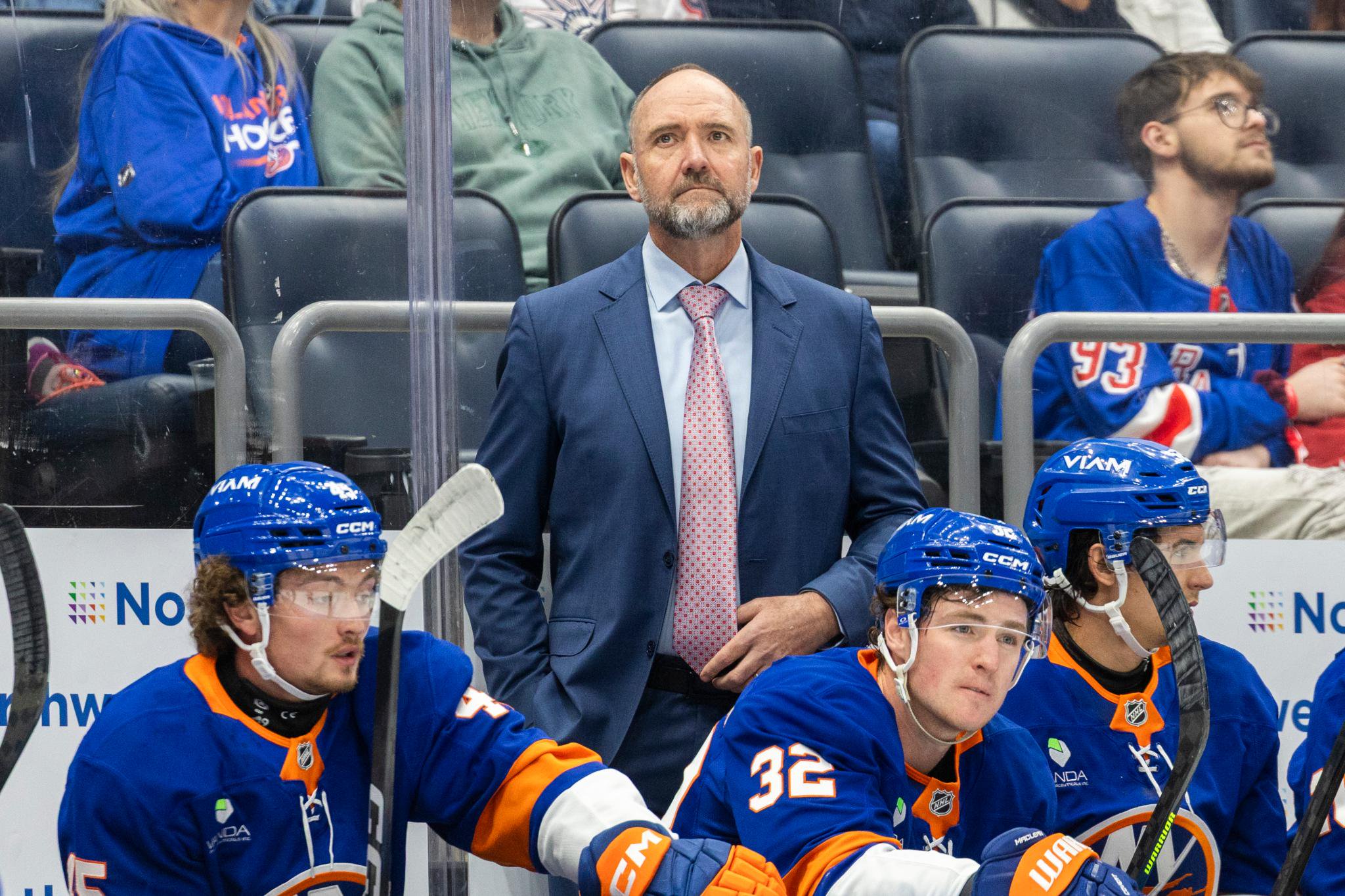 New York Islanders head coach Pete DeBoer watches from the bench during a game against the New York Rangers.