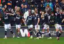 Millwall players celebrate the late winner scored by Japhet Tanganga (far left) during the Sky Bet Championship match between Millwall and Birmingh...