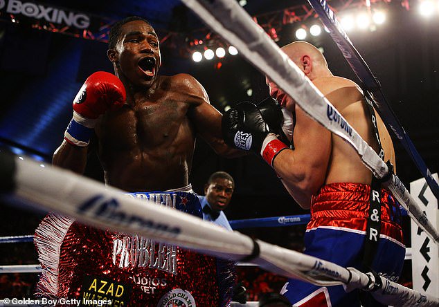Adrien Broner punches Gavin Rees during their WBC Lightweight Title fight at Atlantic City Boardwalk Hall in 2013. Broner won the WBO Super Featherweight title at just 22 in 2011
