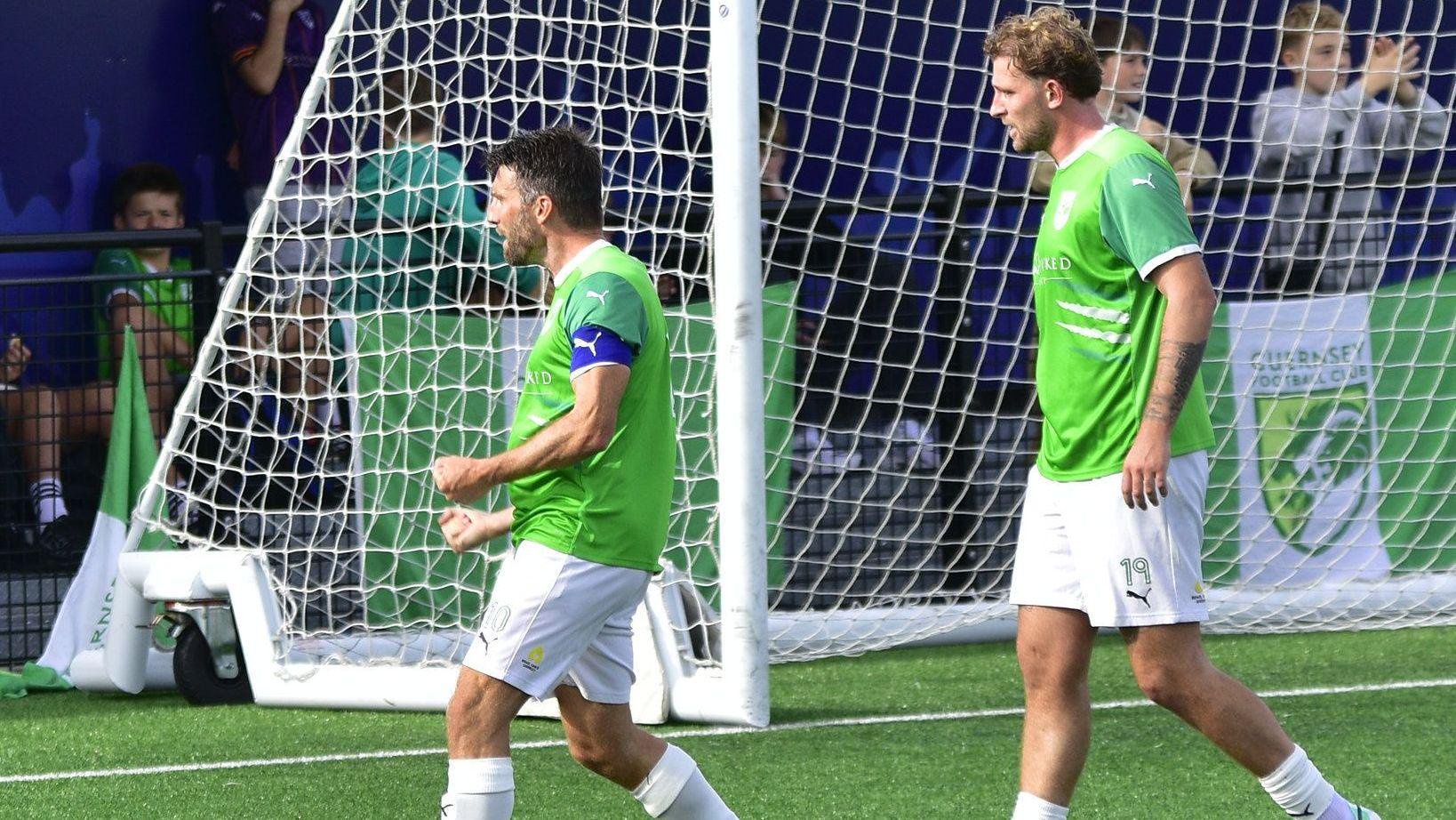 Ross Allen and Will Fazakerley celebrate a goal 