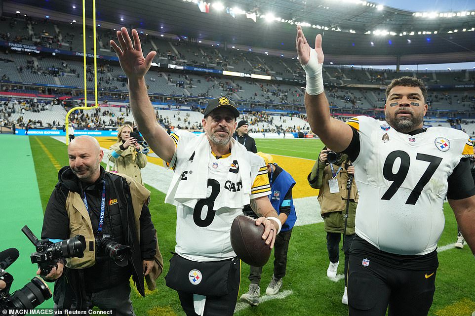On the field, Rodgers rolled back the years as he scrambled on a key fourth-quarter play to seal victory over the Saints. The 42-year-old left the pocket on third-and-6 and picked up eight yards before being tackled just before the two-minute warning to help Pittsburgh seal a 16-10 victory. 'Sometimes you've got to suck it up and make a play for your guys,' Rodgers said. 'I think because I am so much less athletic than I used to be, it actually fires up the guys even more.' Rodgers threw a touchdown pass – the 540th of his career, moving past Peyton Manning for third in NFL history – and Chris Boswell kicked three field goals at Stade de France. Jaylen Warren rushed for 101 yards on 18 carries and Rodgers completed 19 of 30 passes for 212 yards as the Steelers won their third straight game and moved to 5-2.