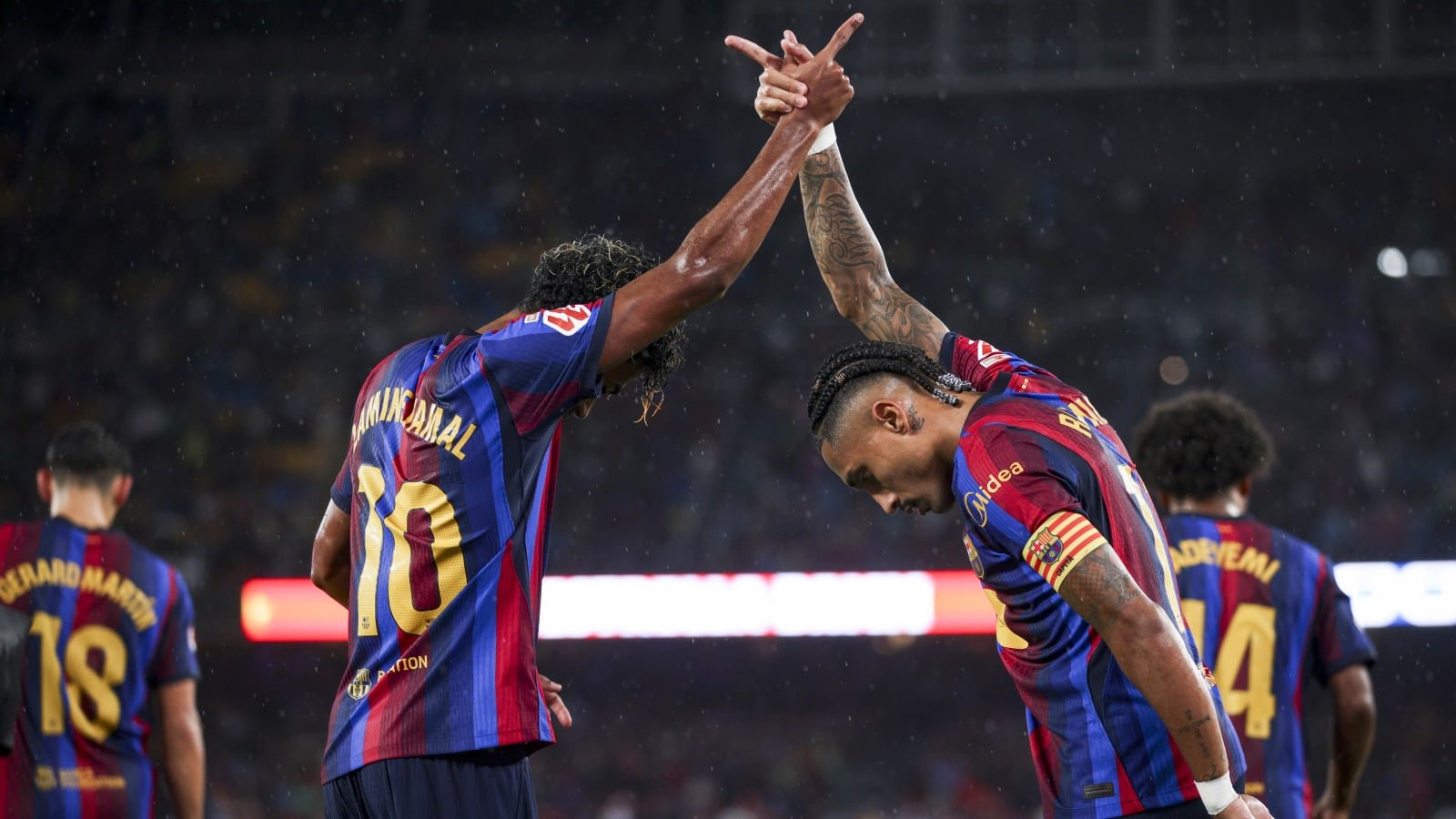 FC Barcelona's Lamine Yamal and Raphinha celebrate a goal against Racing Santander in a 2026-27 La Liga game