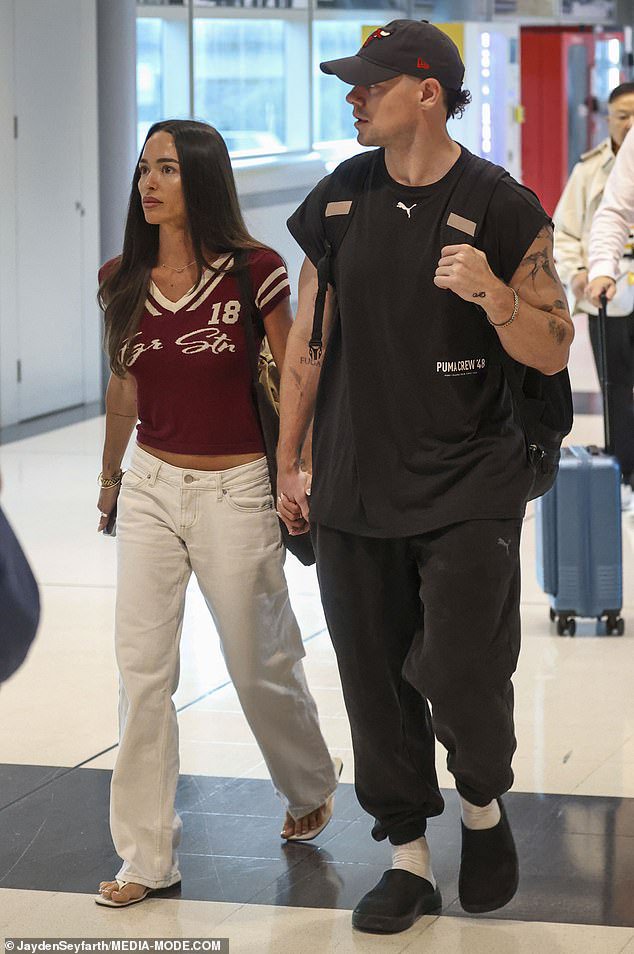 Meanwhile, former Brisbane Lions player Lachie, 33, turned heads in a questionable outfit, wearing a pair of baggy tracksuit pants and a matching black T-shirt along with socks and slip-on shoes