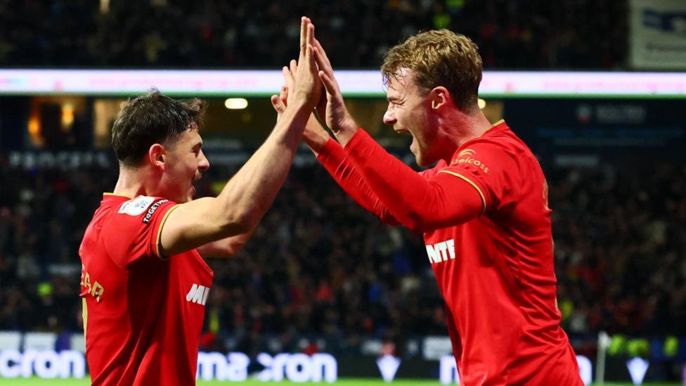 Will Lankshear (left) celebrates his first goal at Bolton with Tommy Conway