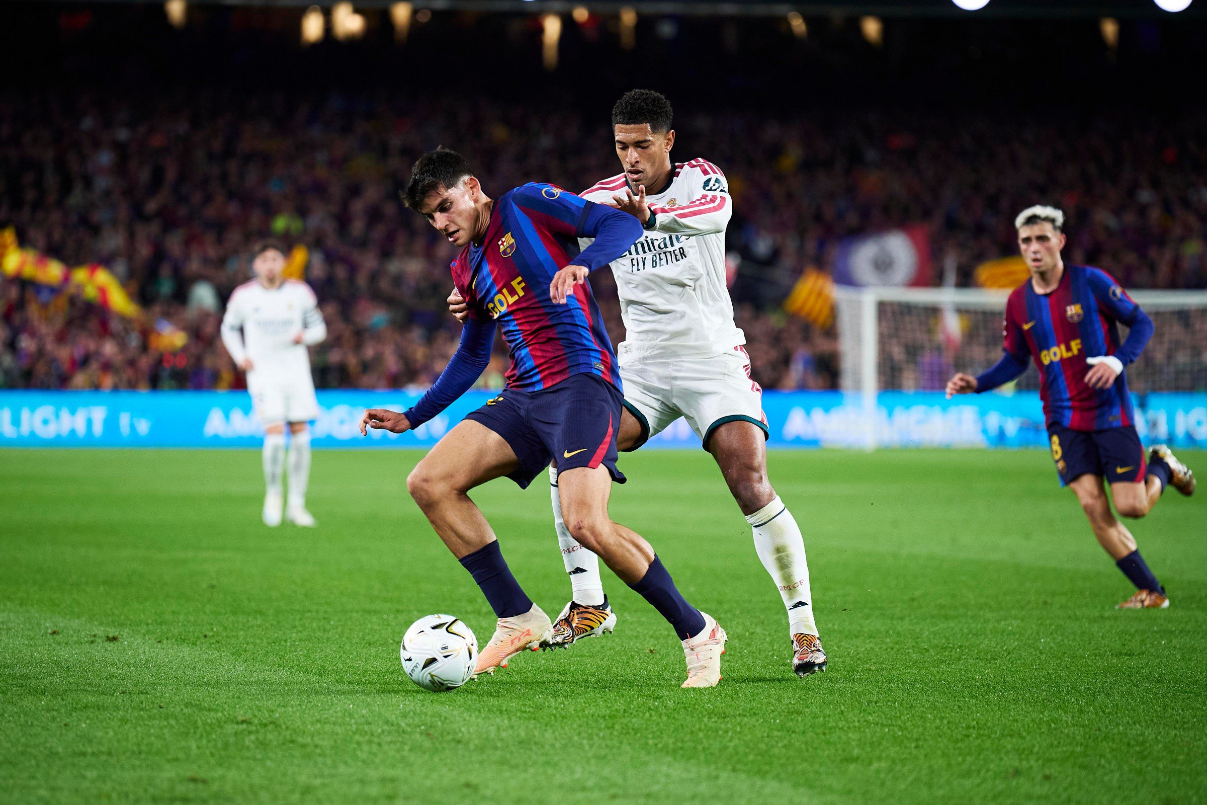 BARCELONA, SPAIN - OCTOBER 25: Gerard Martin of FC Barcelona competes for the ball with Jude Bellingham of Real Madrid during the LaLiga EA Sports 2026/27 match between FC Barcelona and Real Madrid at Spotify Camp Nou on October 25, 2026 in Barcelona, Spain. (Photo by Pablo Rodriguez/Quality Sport Images/Getty Images)