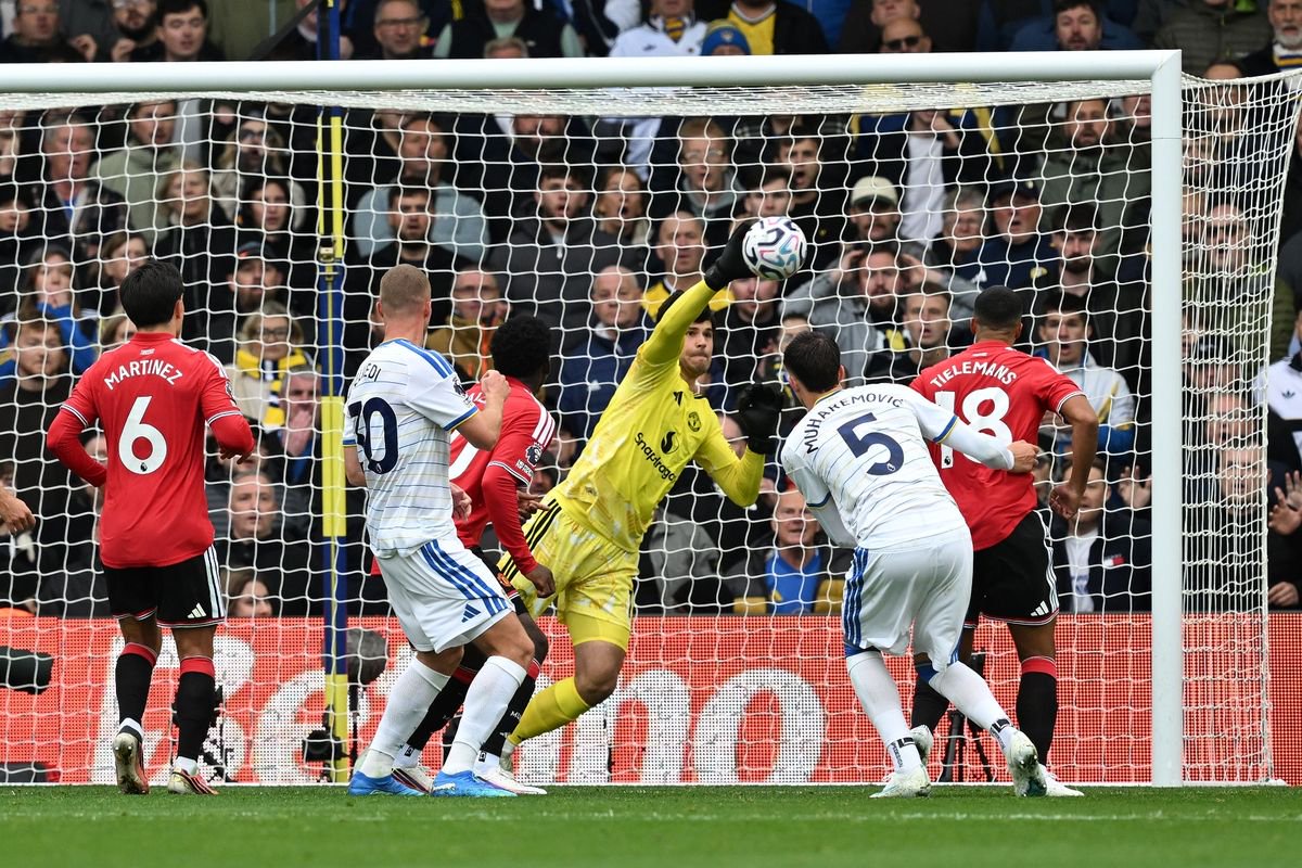 Senne Lammens goalkeeper of Manchester United saves from Nico Elvedi of Leeds United