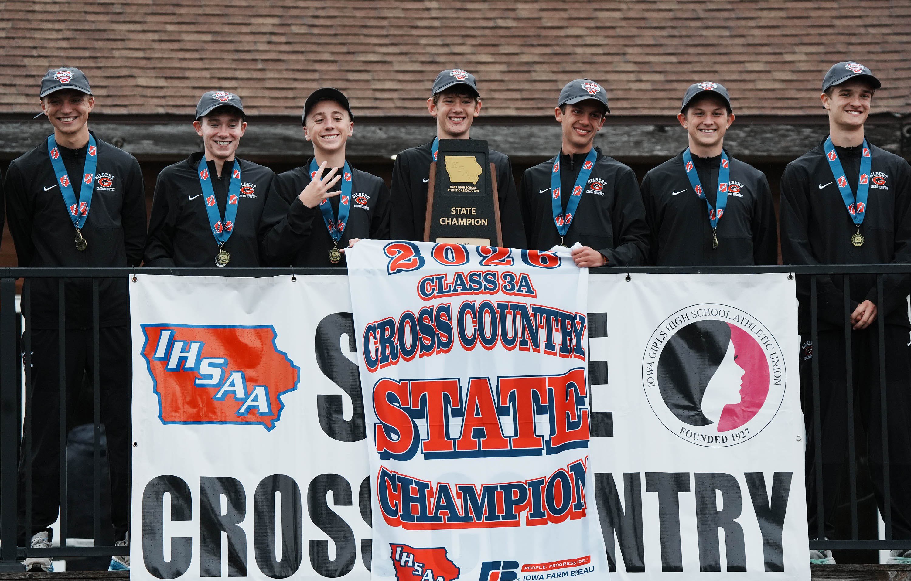 The Gilbert boys cross country team celebrates after winning the Class 3A boys state cross country race at Lakeside Municipal Golf Course on Oct. 31, 2026, in Fort Dodge, Iowa.