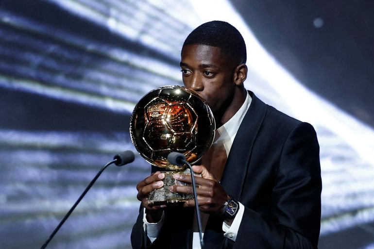 Paris St Germain's Ousmane Dembele celebrates after winning the men's Ballon d'Or award