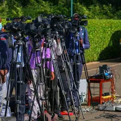 May be an image of 2 people and camera