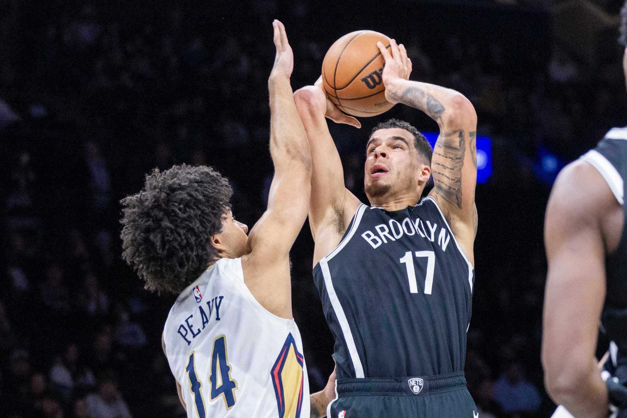Brooklyn Nets' Michael Porter Jr. goes up for a shot as New Orleans Pelicans' Micah Peavy (14) defends during the second half of an NBA basketball game at Barclays Center, Saturday, Dec. 6, 2025, in Brooklyn, N.Y.