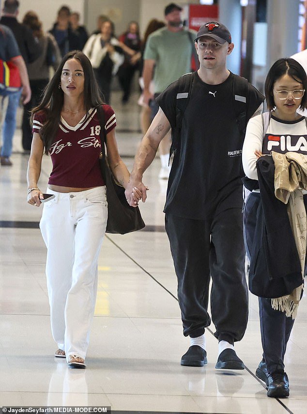 Emma, 29, looked every inch the footy WAG in a sporty Jagger & Stone burgundy and white T-shirt teamed with white jeans and matching white sandals