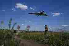 Ukrainian servicemen of the Ochi reconnaissance unit launch a Furia drone to fly over Russian positions at the frontline in Donetsk