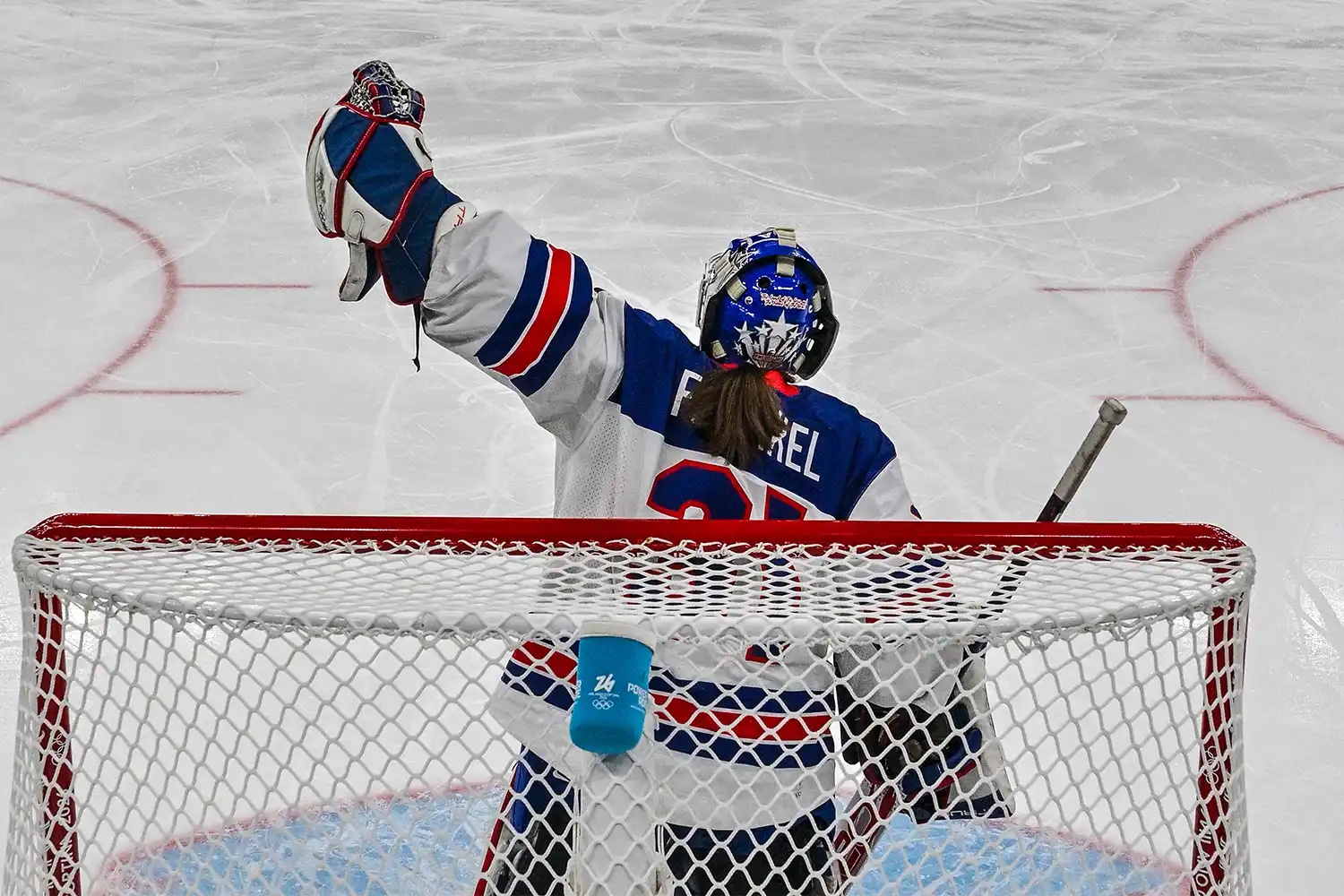 USA's goalkeeper #31 Aerin Frankel celebrates a team goal during the women's preliminary round Group A Ice Hockey match between Canada and USA at the Milano Santagiulia Ice Hockey Arena during the Milano Cortina 2026 Winter Olympic Games in Milan, on February 10, 2026.