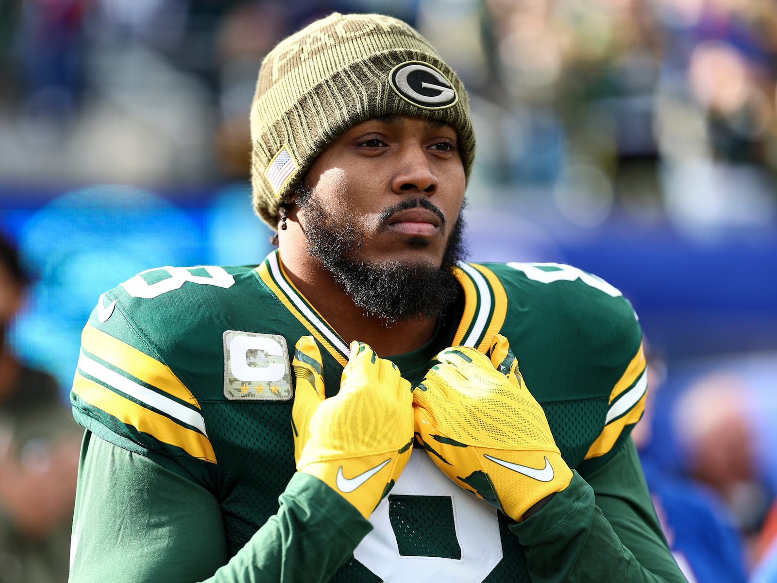 EAST RUTHERFORD, NEW JERSEY - NOVEMBER 16: Josh Jacobs #8 of the Green Bay Packers stands on the sidelines during the national anthem prior to an NFL football game against the New York Giants at MetLife Stadium on November 16, 2025 in East Rutherford, New Jersey. (Photo by Kevin Sabitus/Getty Images)