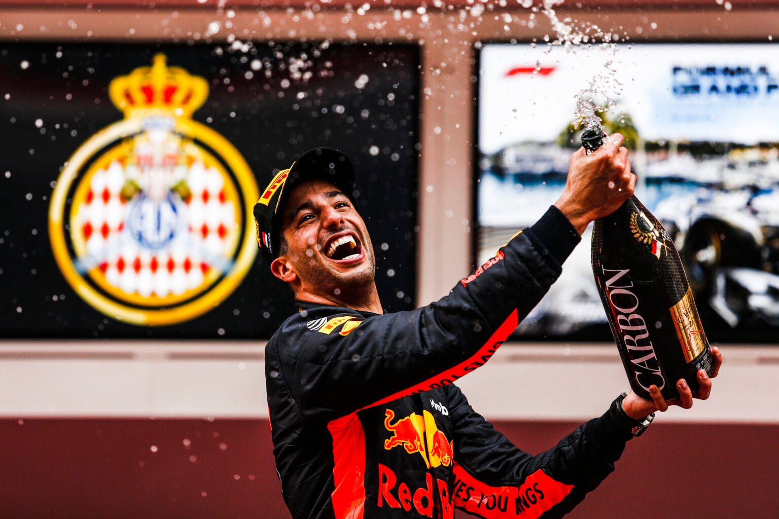 Daniel Ricciardo of Red Bull sprays champagne on the 2018 Monaco Grand Prix podium