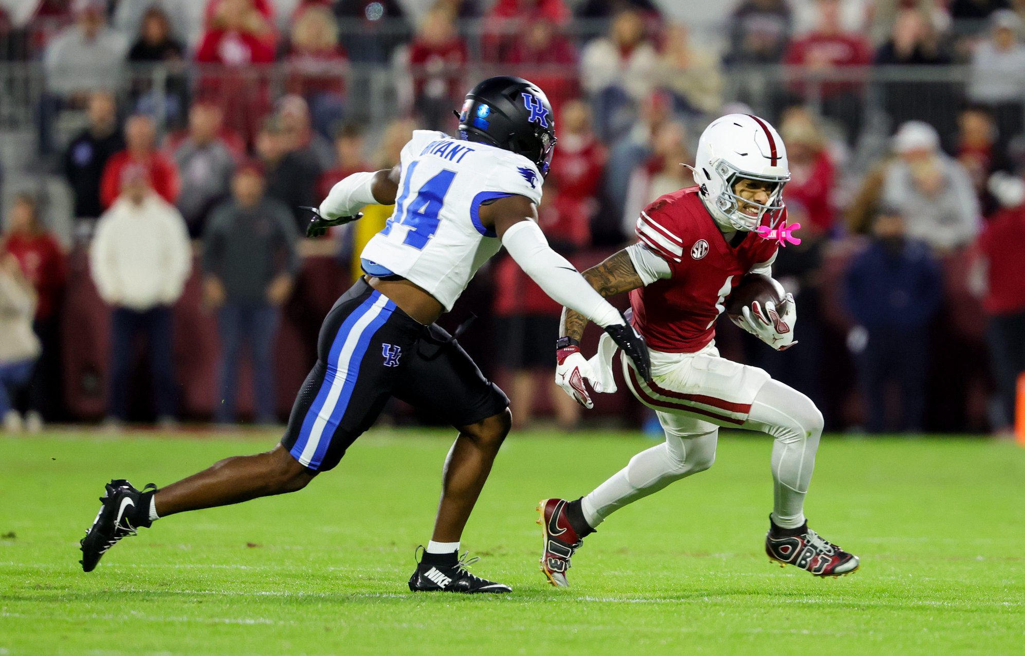 Oct 17, 2026; Norman, Oklahoma, USA;  Oklahoma Sooners wide receiver Isaiah Sategna III (1) runs with the ball as Kentucky Wildcats defensive back Ty Bryant (14) defends during the first quarter at Gaylord Family-Oklahoma Memorial Stadium. Mandatory Credit: Kevin Jairaj-Imagn Images
