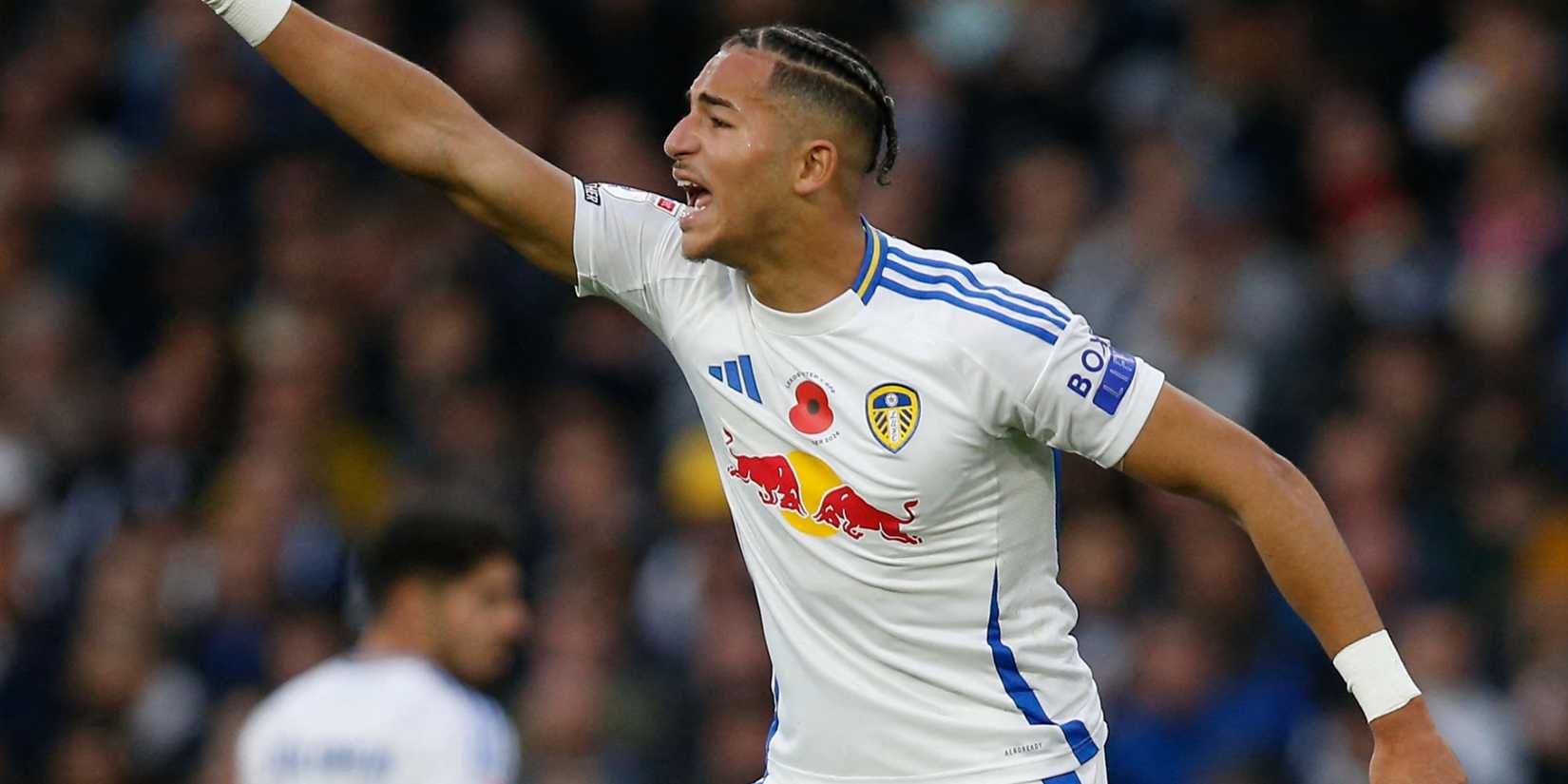 Leeds United forward Mateo Joseph signals to the sky
