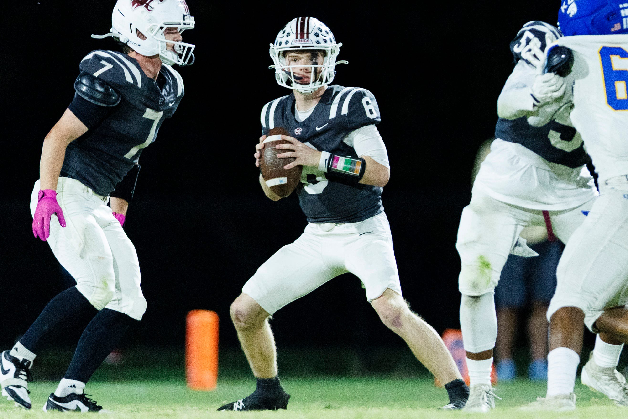 Holy Cross quarterback Jerek Hoover looks to pass during the game between Holy Cross and Kentucky Country Day on Oct 9, 2026; Louisville, KY, USA; at Holy Cross High School.