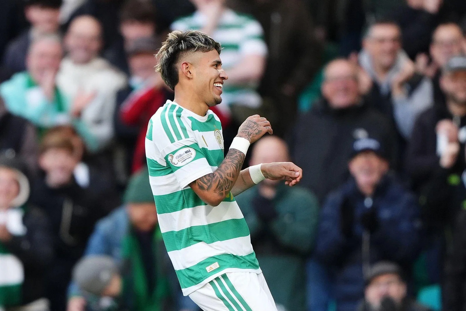 Celtic's Camilo Duran celebrates scoring their side's sixth goal during the Premiership match at Celtic Park
