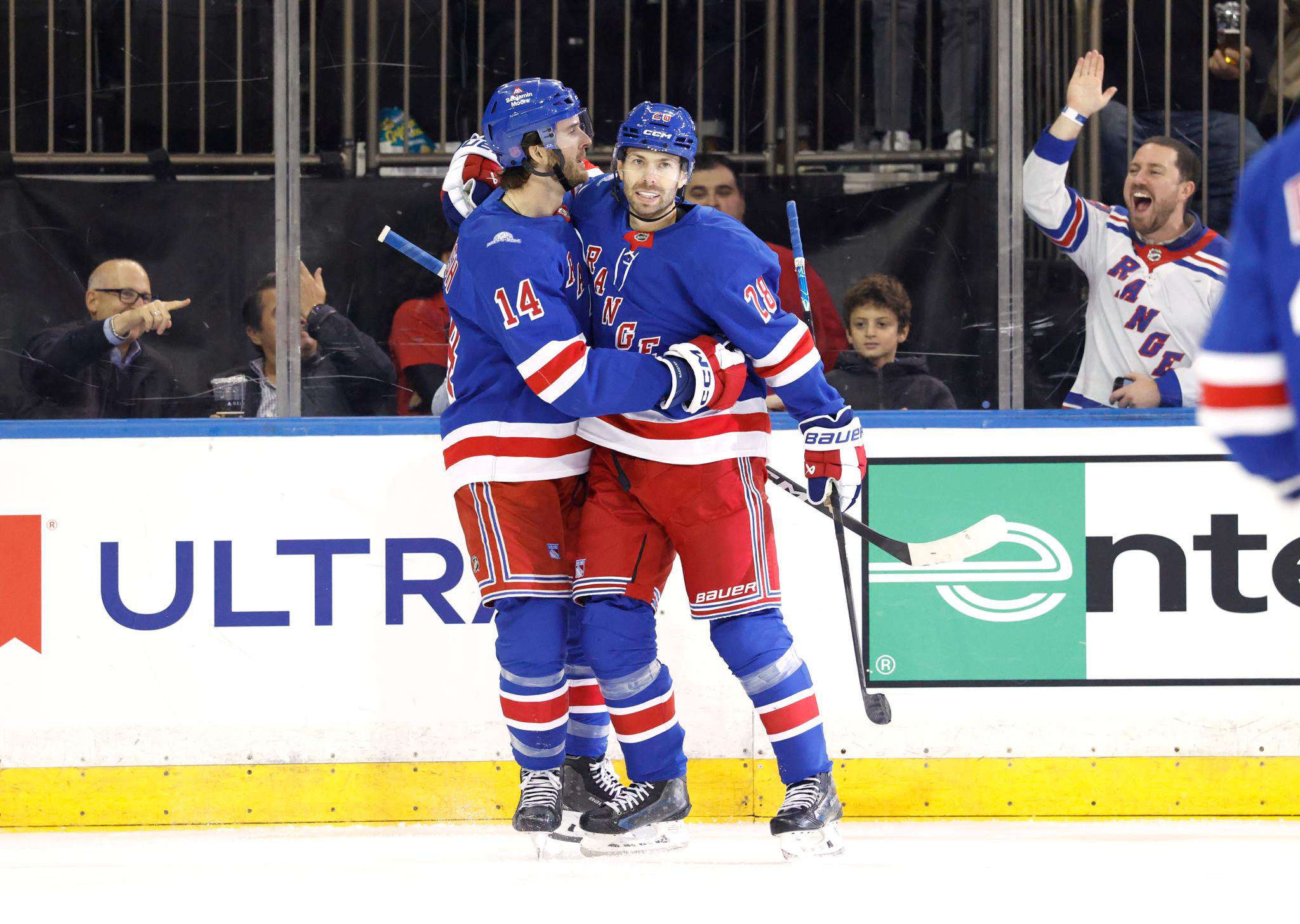 New York Rangers right wing Oliver Bjorkstrand celebrates a goal with right wing Taylor Raddysh during a game against the Anaheim Ducks.