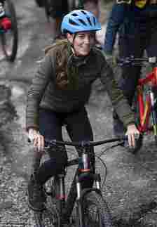 Kate Middleton rides a mountain bike during a visit to the Windermere Adventure Training Centre with RAF Cadets on September 21,2021