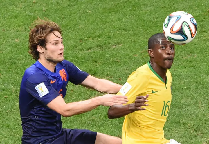 Netherlands' Daley Blind and Brazil's Ramires vie for the ball in a FIFA World Cup match in 2014. 