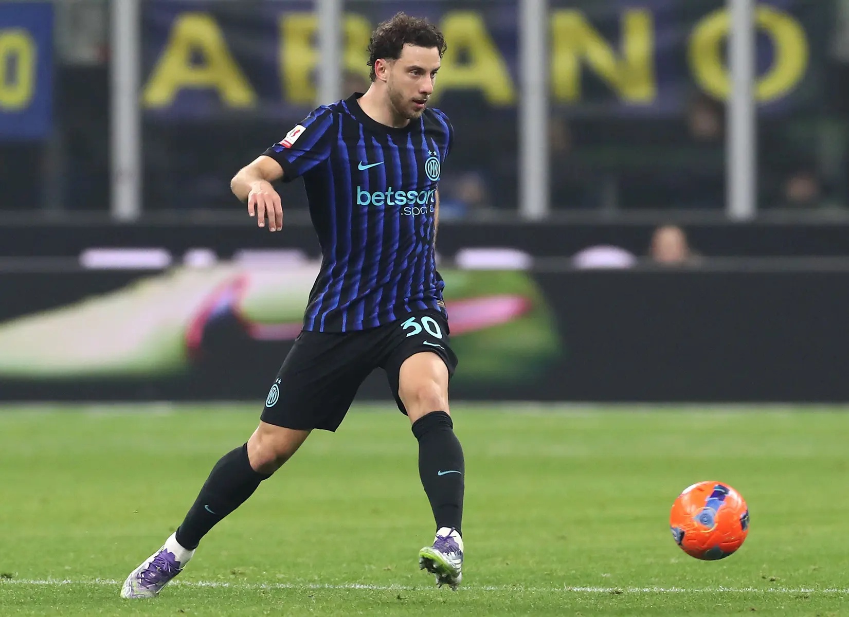 Carlos Augusto of FC Internazionale in action during a match against Venezia FC.